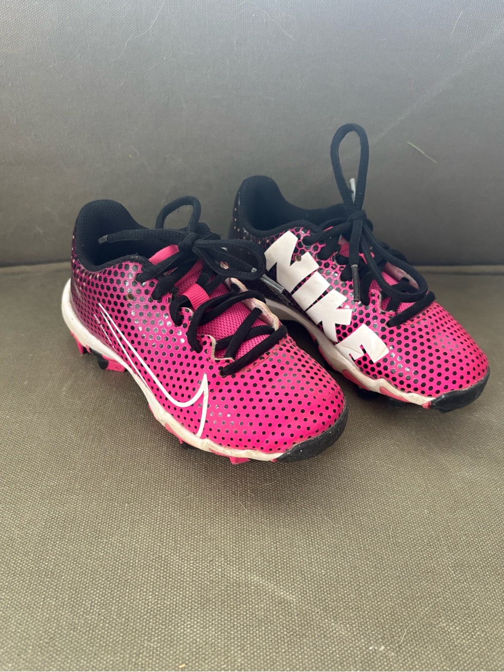 Nike Kids Pink and Black Sports Cleats with White Swoosh